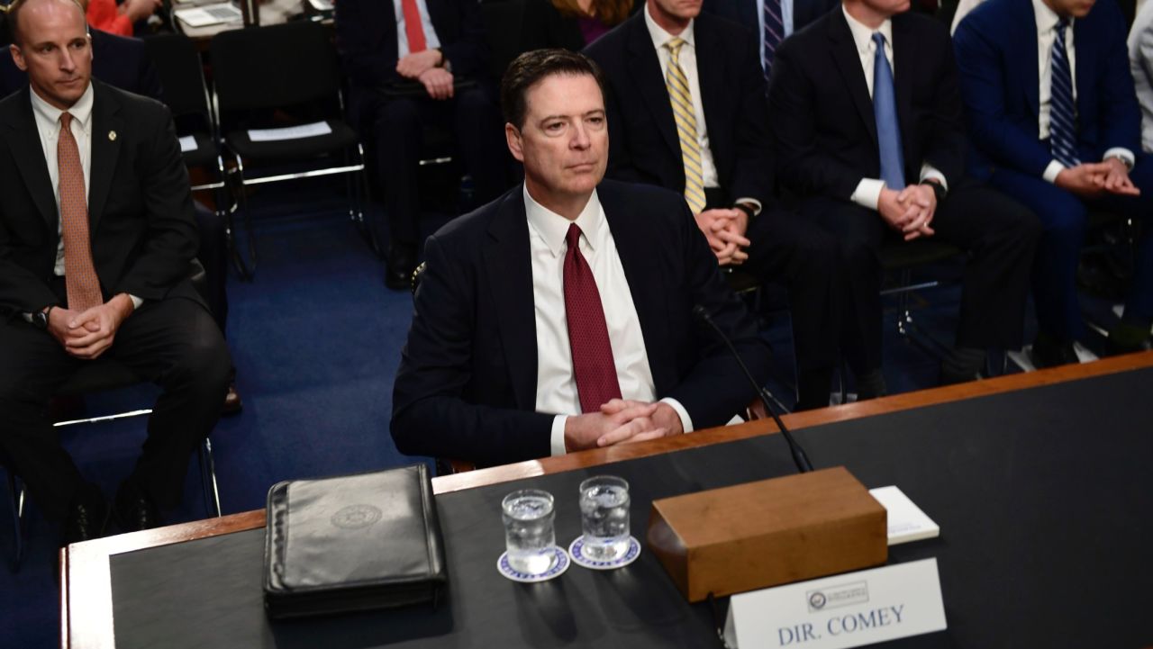 Former FBI Director James Comey arrives to testify during a US Senate Select Committee on Intelligence hearing on Capitol Hill in Washington,DC, June 8, 2017. / AFP PHOTO / Brendan Smialowski        (Photo credit should read BRENDAN SMIALOWSKI/AFP/Getty Images)