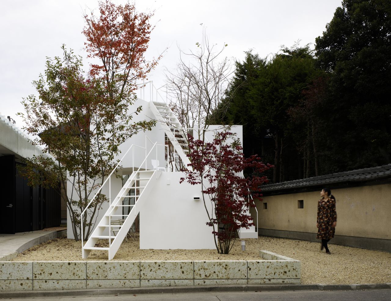This house designed by Sou Fujimoto mirrors a porous mountain. Large trees dwarf small minimalist blocks.