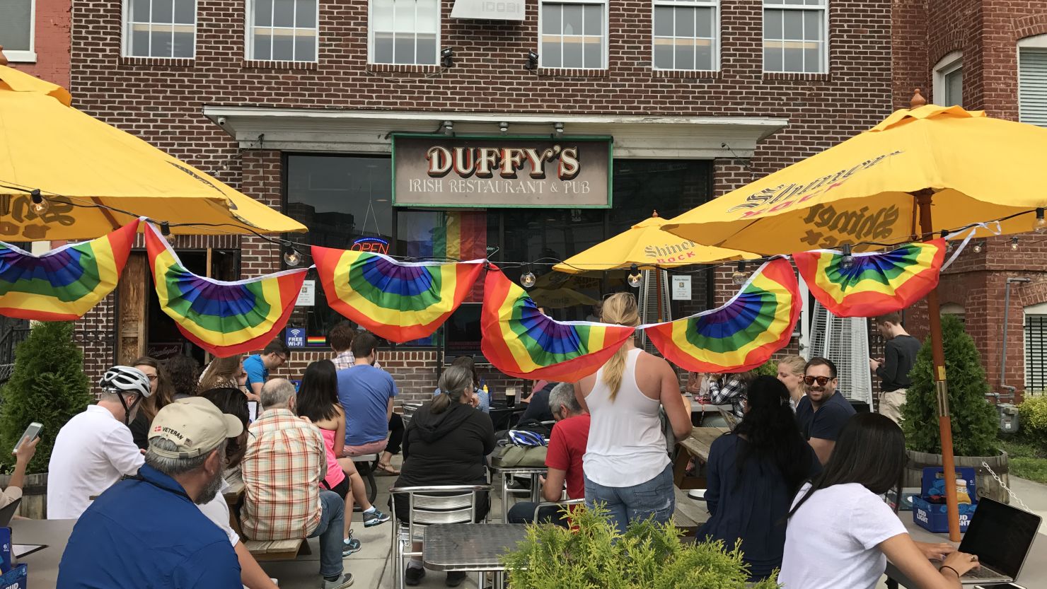 A crowd gathered outside Duffy's Irish Pub in Washington on Thursday June 8, 2017, for ousted FBI Director James Comey's testimony on the Hill.