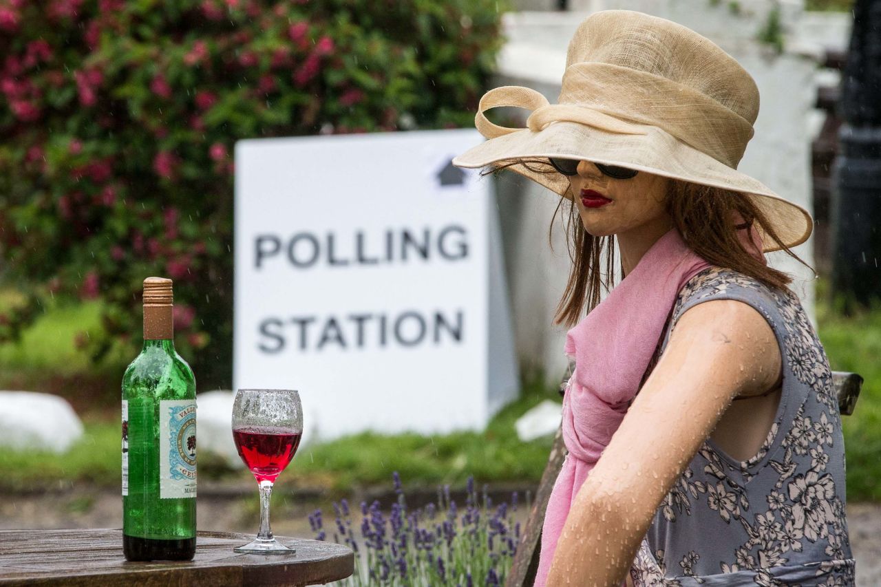 A mannequin sits on display outside a pub where a polling station was set up in Roecliffe, England.