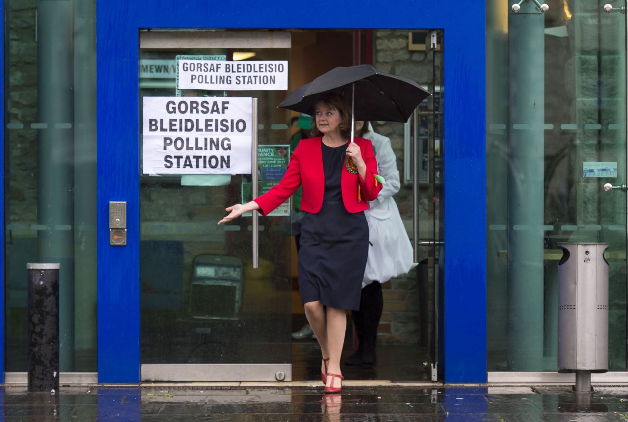Leanne Wood, leader of the party Plaid Cymru, leaves a polling station after voting in Rhondda, Wales.