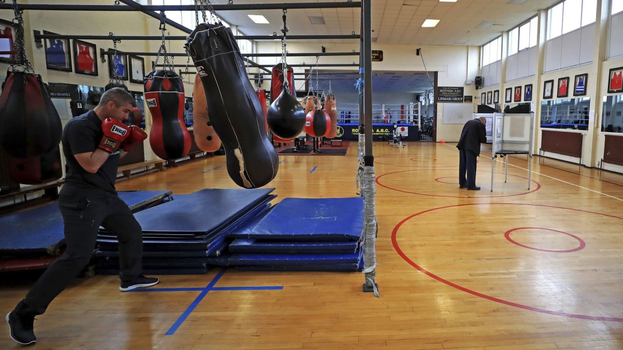 A man casts his vote at a boxing gym in Liverpool, England.