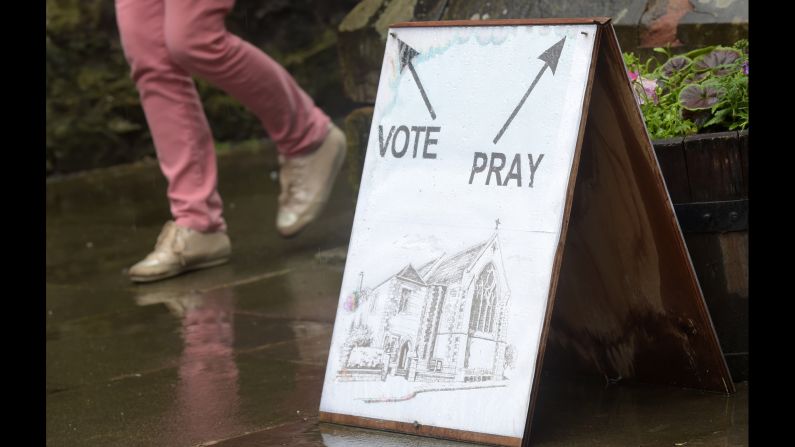 A sign directs voters at a polling station at St. James Church in Edinburgh.