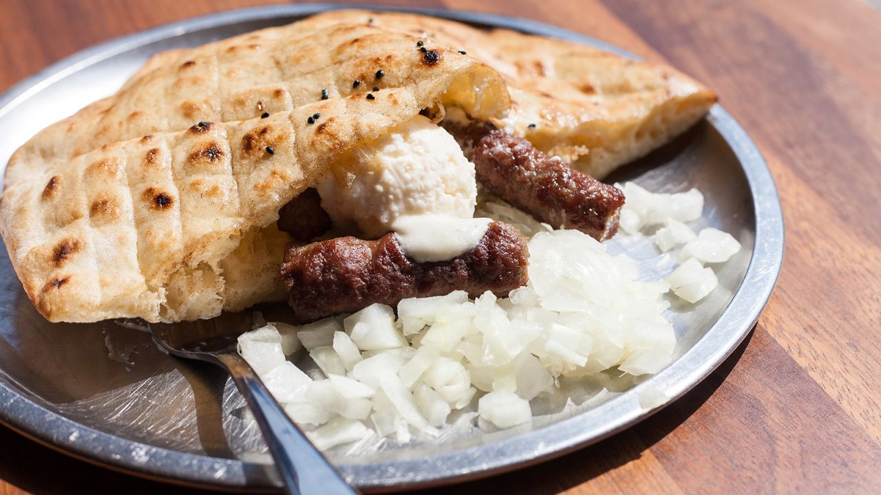 <strong>Eating like a Bosnian: </strong>Bosnians claim they have the best version of a Balkan staple called čevapi. Grilled links of minced beef or lamb are stuffed into somun with onions and sometimes sour cream.