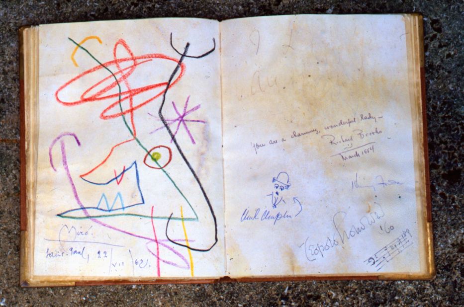 The guest books plays out like a who's who of the 20th century. On one page, the surreal workings of Joan Miro, on the other a caricature from Charlie Chaplin.