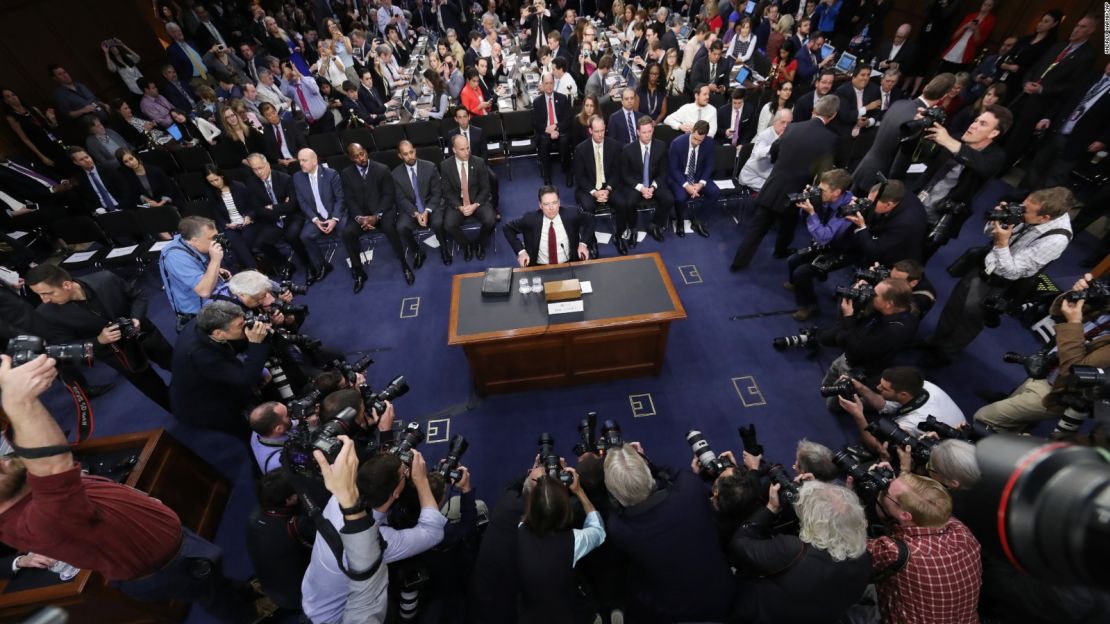 Former FBI director James Comey takes his seat at the beginning of the Senate Intelligence Committee hearing on Capitol Hill, Thursday, June 8, 2017, in Washington. 