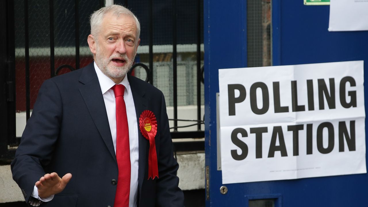 Britain's main opposition Labour Party leader Jeremy Corbyn leaves a polling station after casting his vote.