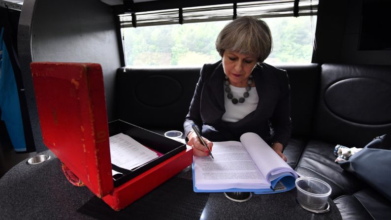 British Prime Minister Theresa May works on the election campaign bus, commonly known as the "Battle Bus," as it travels through Staffordshire, England, on Tuesday, June 6. After one of the most tumultuous years in British political history, <a href="http://www.cnn.com/2017/06/08/europe/uk-election-day/index.html" target="_blank">polls opened in the country's general election</a> on Thursday, June 8. The snap election was called by May with a focus on securing a mandate to take into Brexit talks.