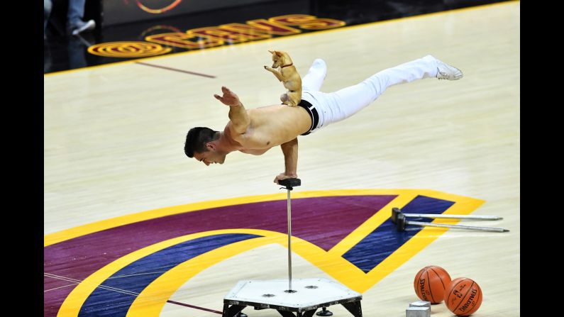 A man performs during the halftime show of Game 3 of the NBA Finals in Cleveland on Wednesday, June 7. The Golden State Warriors defeated the Cleveland Cavaliers 118-113.