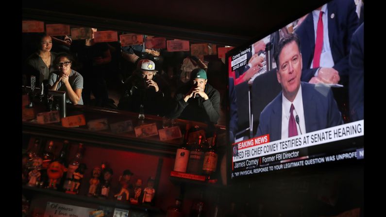 People at Ace's Bar in San Francisco watch a television broadcast of former FBI Director James Comey as he <a href="http://www.cnn.com/2017/06/08/politics/james-comey-testimony-donald-trump/index.html" target="_blank">testifies before the Senate intelligence committee</a> on June 8. Bars and restaurants across the nation opened early for communal watching. <a href="http://www.cnn.com/2017/06/08/politics/comey-hearing-viewing-parties-reaction/index.html" target="_blank">Comey testimony: In bars, at work and in pajamas, the nation watches</a>