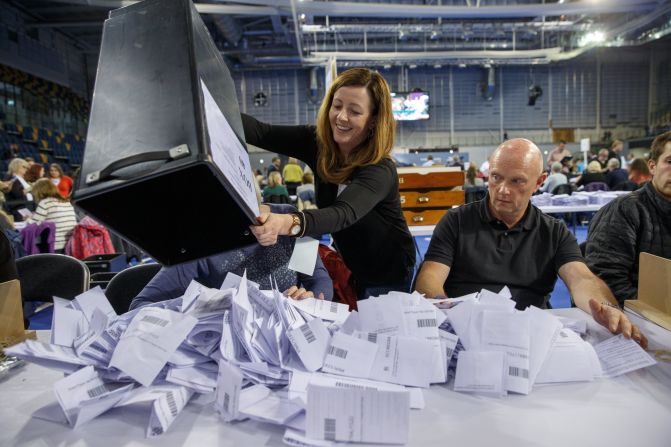 Officials count votes in Glasgow on June 8.