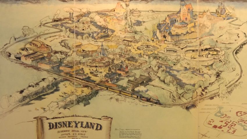 Mike Van Eaton stands next to the original map of Disneyland set for auction at his animation gallery in Sherman Oaks, California next month.