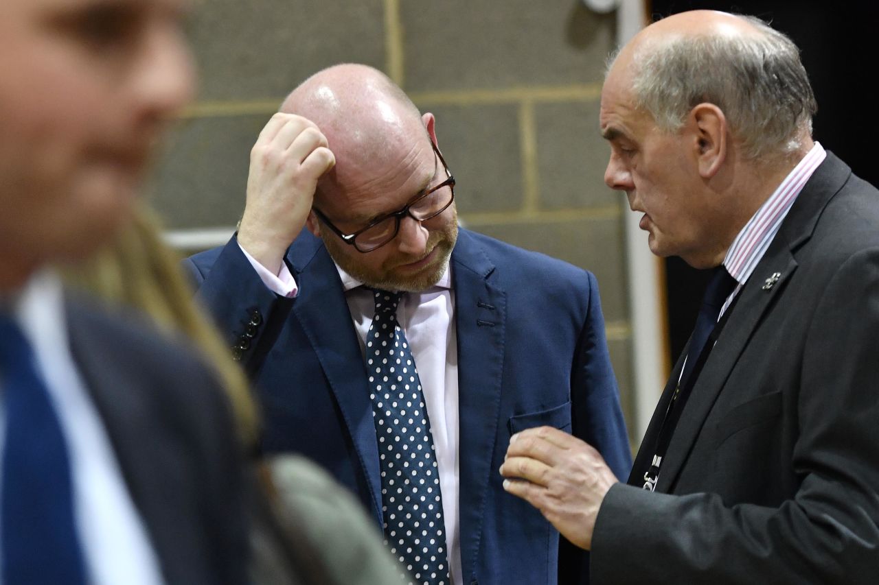 UK Independence Party leader Paul Nuttall, center, speaks with a party member following the vote count. Nuttall resigned later, leaving UKIP seeking its third leader in a year.