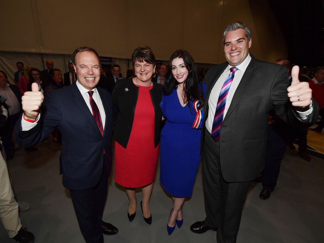 DUP leader Arlene Foster, DUP deputy leader and north Belfast candidate Nigel Dodds, Emma Little Pengelly  DUP south Belfast candidate and Gavin Robinson DUP east Belfast candidate celebrate at the Belfast count centre on June 9, 2017 in Belfast. 