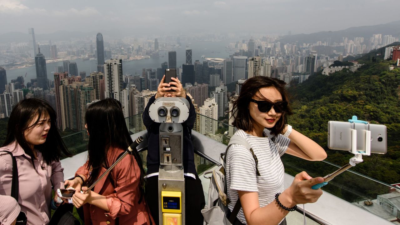 <strong>Selfie central: </strong>Tourists take selfies during a visit to the viewing deck of Victoria Peak. Not surprisingly, The Peak is one of Hong Kong's most popular tourist destinations.  