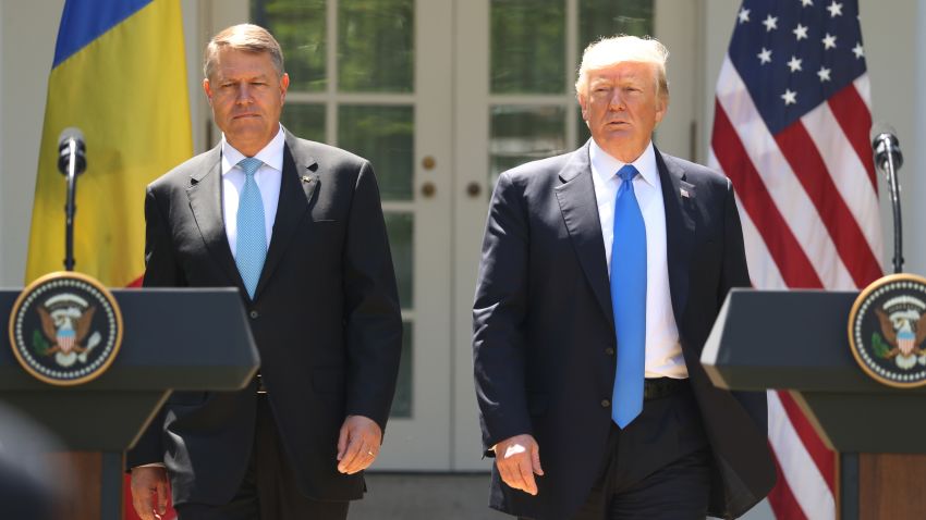 President Donald Trump, accompanied by Romanian President Klaus Werner Iohannis, walk to the dais to begin a news conference in the Rose Garden at the White House, Friday, June 9, 2017, in Washington. (AP Photo/Andrew Harnik)