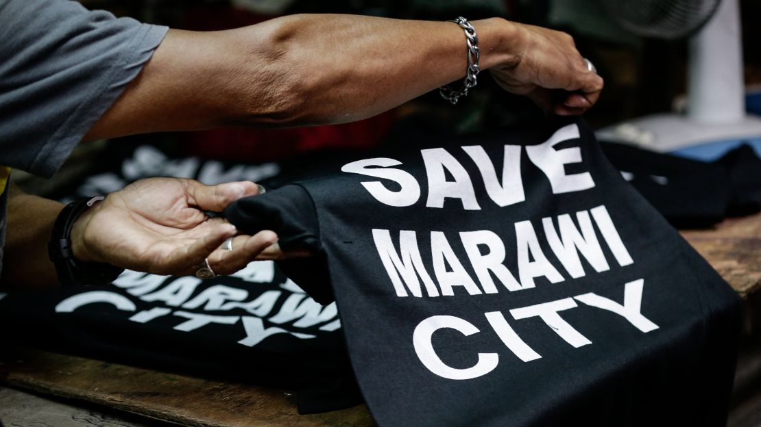 "Save Marawi City" T-shirts are sold in Manila to help victims of the fighting.