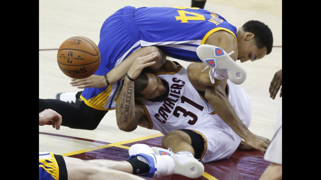 Livingston lands on Cleveland guard Deron Williams during the second half of Game 4.
