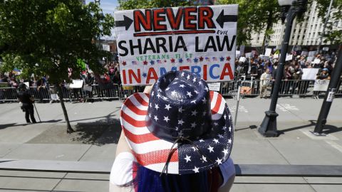 Cathy Camper of Tacoma, Washington, wears a stars-and-stripes cowboy hat as she rallied against Islamic law in Seattle.