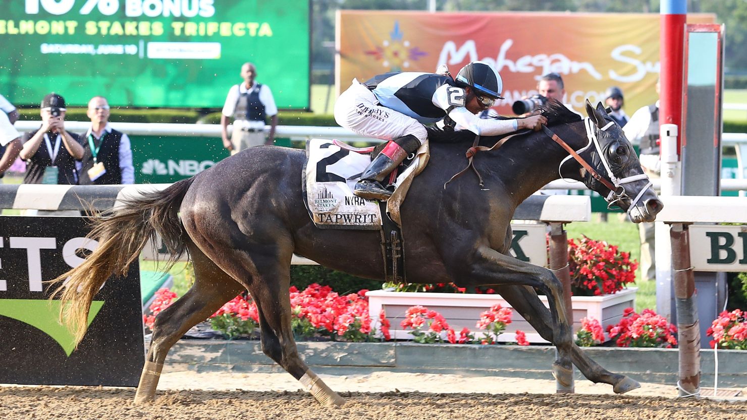 Jockey Jose Ortiz rides Tapwrit to a two-length victory.