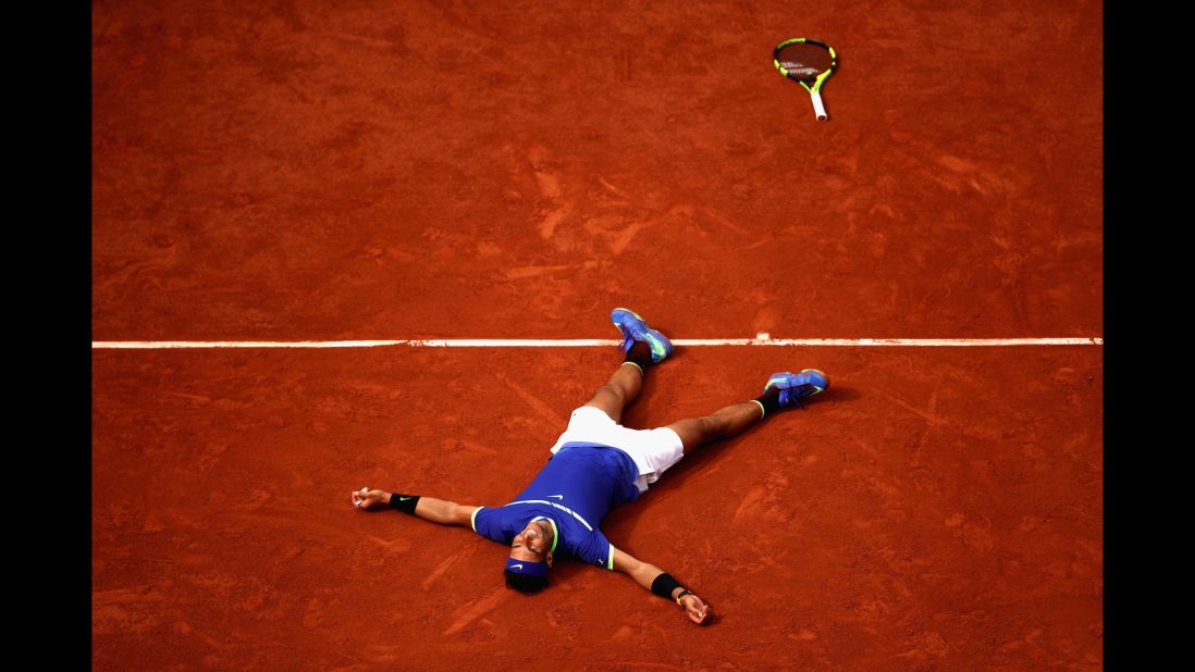 Spain's Rafael Nadal celebrates victory in the men's singles final against Stan Wawrinka of Switzerland at Roland Garros in Paris on June 11, 2017. The win meant Nadal claimed his 10th French Open title.