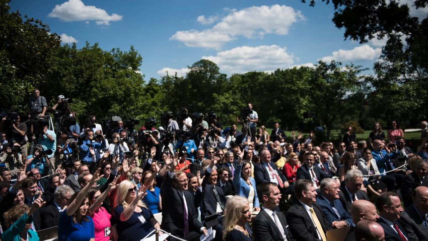 Reporters raise their hands to ask questions of US President Donald Trump and Romania's President Klaus Iohannis during a press conference in the Rose Garden of the White House June 9, 2017 in Washington, DC. / AFP PHOTO / Brendan Smialowski (Photo credit should read BRENDAN SMIALOWSKI/AFP/Getty Images)