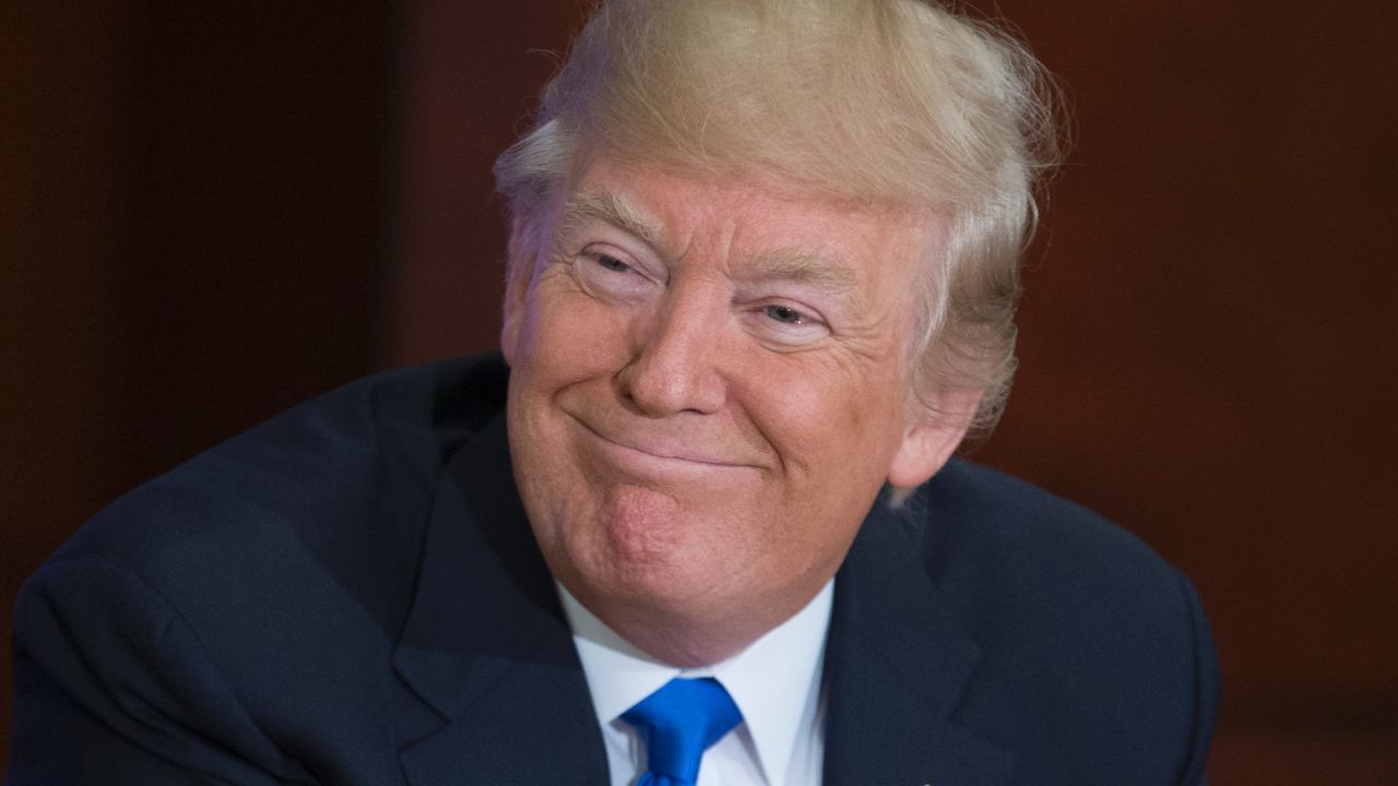 WASHINGTON, DC - JUNE 09: US President Donald Trump (R) participates in the 'Roads, Rails, and Regulatory Relief roundtable meeting', at the Department of Transportation on June 9, 2017 in Washington, DC.  (Photo by Michael Reynolds-Pool/Getty Images)