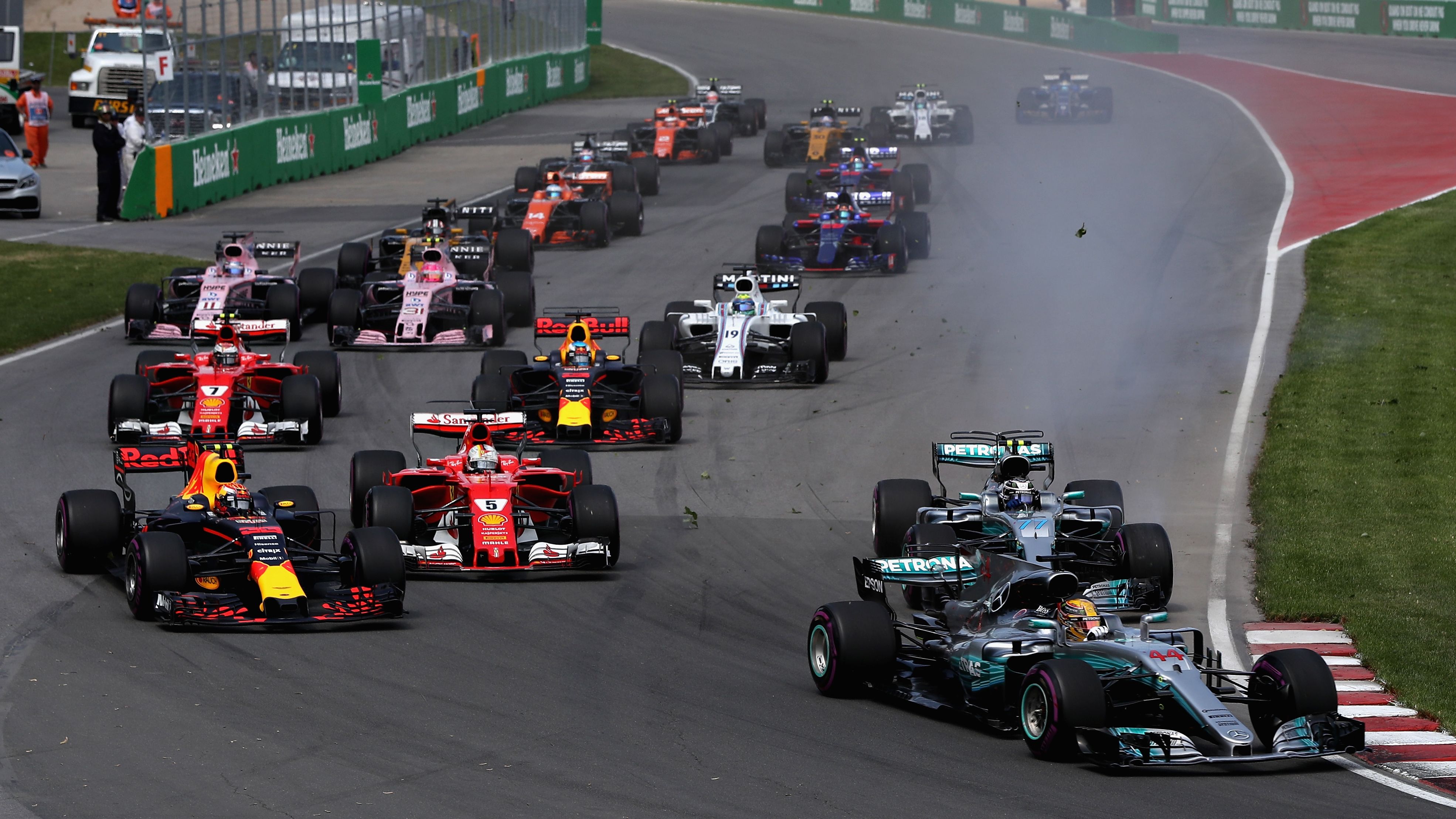 Lewis Hamilton (No. 44) leads into Turn One at the start of the Canadian Grand Prix.  