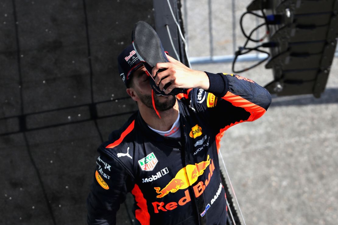Daniel Ricciardo reprises his "shoey" celebration on the podium in Montreal.