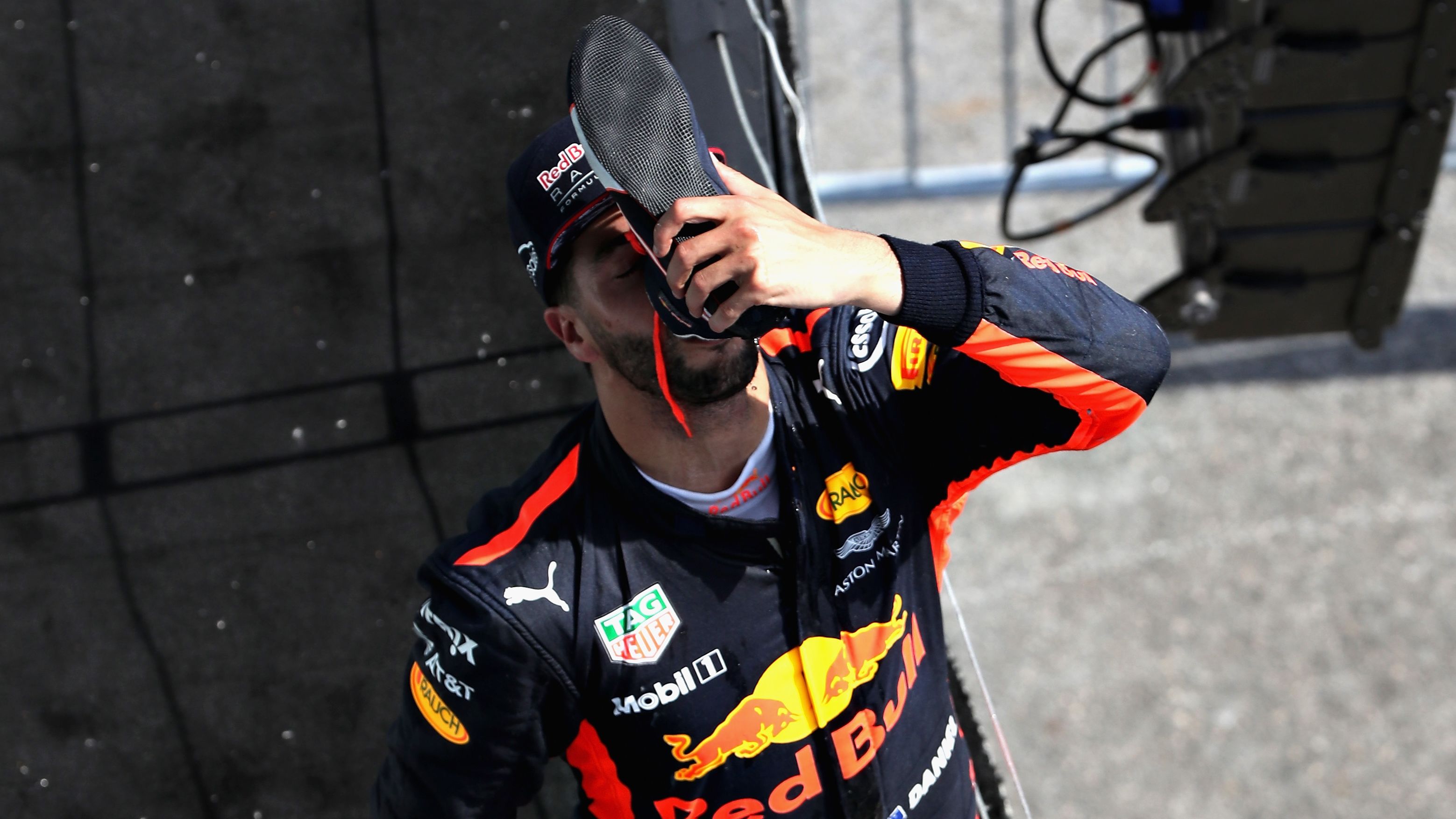 Daniel Ricciardo reprises his "shoey" celebration on the podium in Montreal.