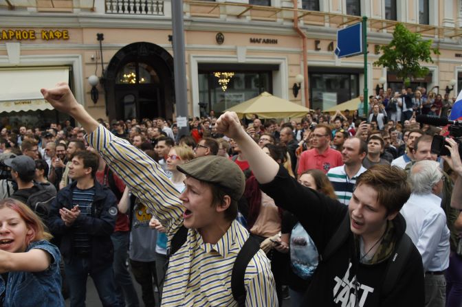 People chant slogans during the rally in Moscow.