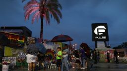 People visit the memorial to the victims of the mass shooting setup around the Pulse gay nightclub one day before the one year anniversary of the shooting on June 11, 2017 in Orlando, Florida. Omar Mateen killed 49 people at the club a little after 2 a.m. on June 12, 2016.