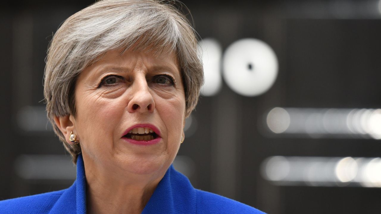 Britain's Prime Minister and leader of the Conservative Party Theresa May, makes a statement outside 10 Downing Street in central London on June 9, 2017 as results from a snap general election show the Conservatives have lost their majority.
British Prime Minister Theresa May will on Friday seek to form a new government, resisting pressure to resign after losing her parliamentary majority ahead of crucial Brexit talks. May is set to meet the head of state Queen Elizabeth II and ask for permission to form a new government, according to her Downing Street office. / AFP PHOTO / Justin TALLIS        (Photo credit should read JUSTIN TALLIS/AFP/Getty Images)