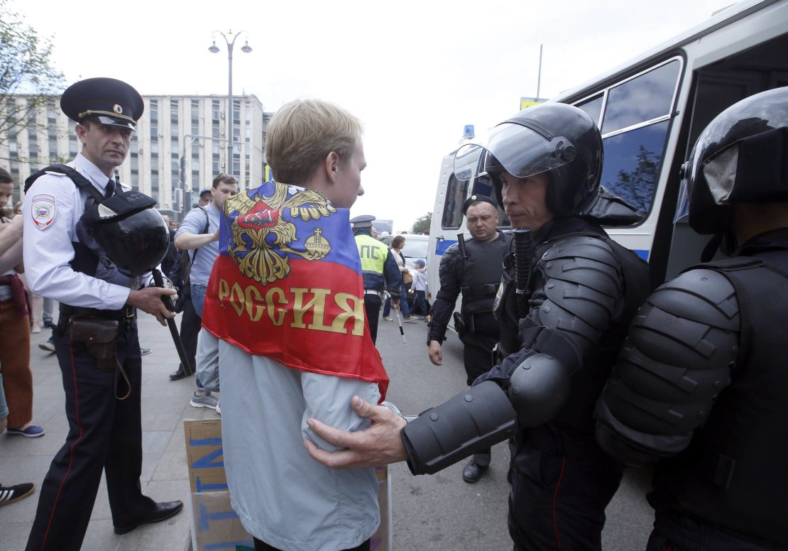 Police detain a participant of an unauthorized rally in Moscow's Tverskaya Street.
