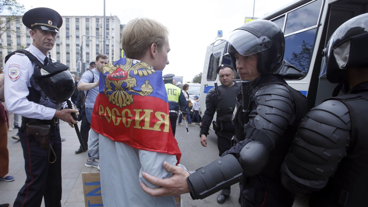 Police detain a participant of an unauthorized rally in Moscow's Tverskaya Street.