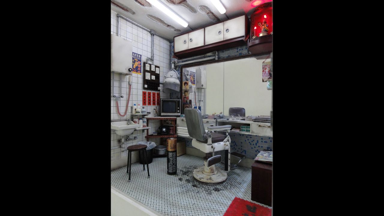 From the hair-strewn floor and stacks of magazines to the 1970s-style TV set, no details are spared in this typical Hong Kong scene.