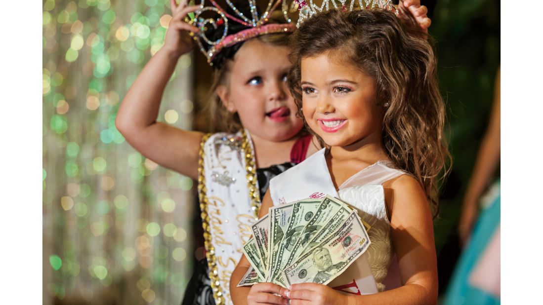 Kailia Deliz, 5, receives her cash award for winning the Ventura County "Summer Fun" Beauty Pageant in 2011.