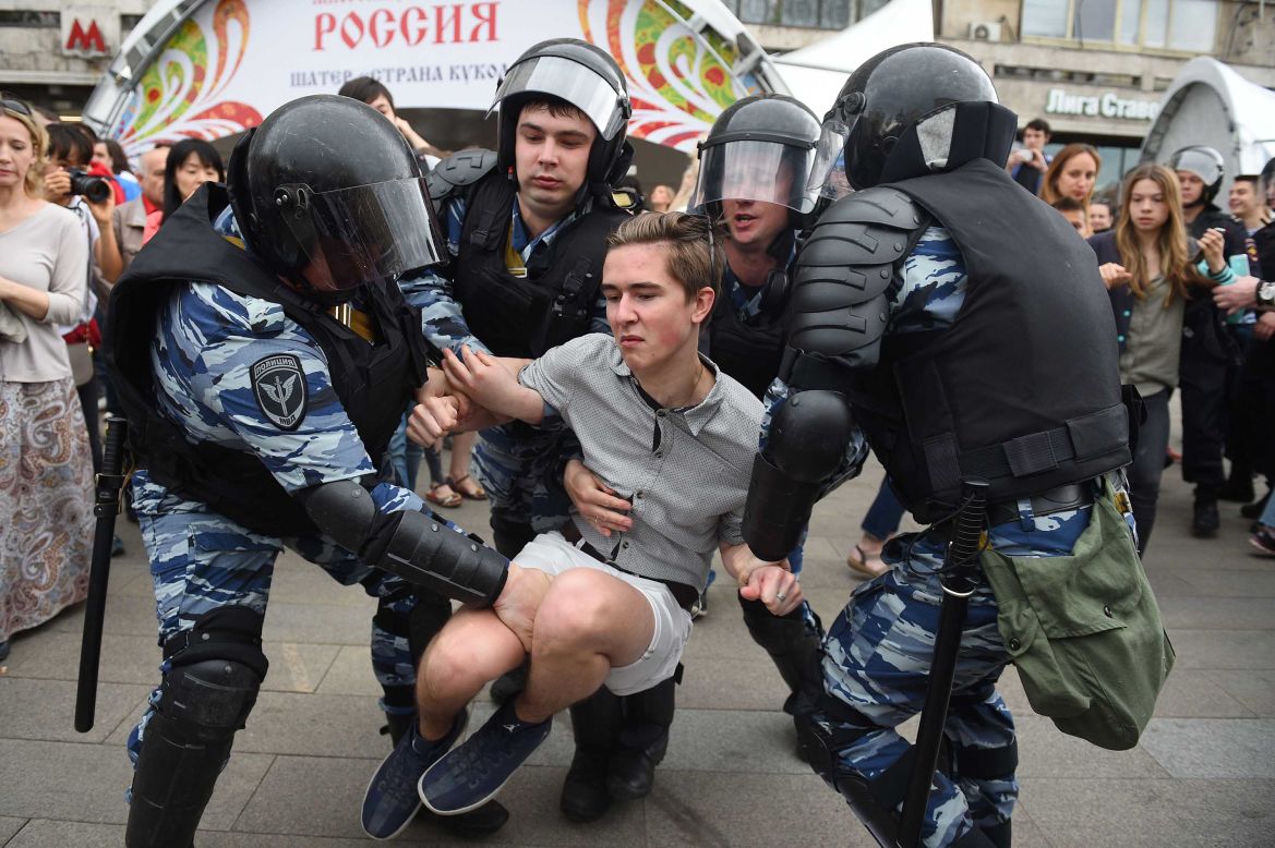 Russian police officers detain a participant of an unauthorized opposition rally in Tverskaya street in central Moscow.