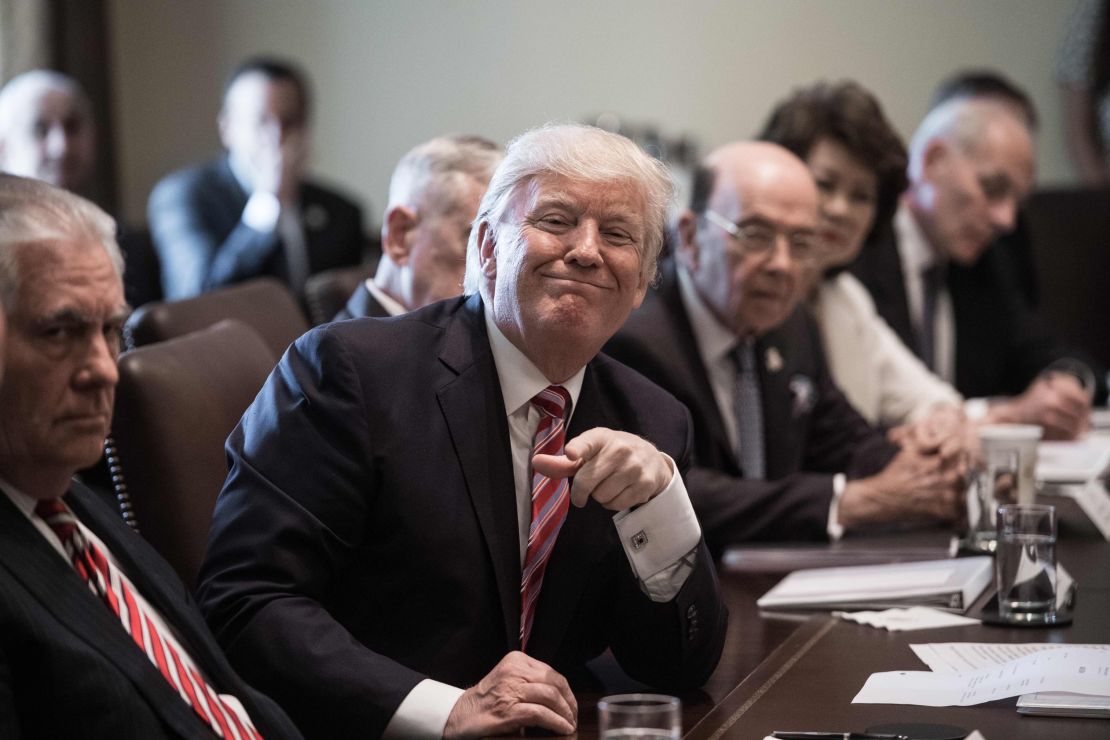 President Donald Trump smiles during a cabinet meeting at the White House in Washington, DC, on June 12, 2017.