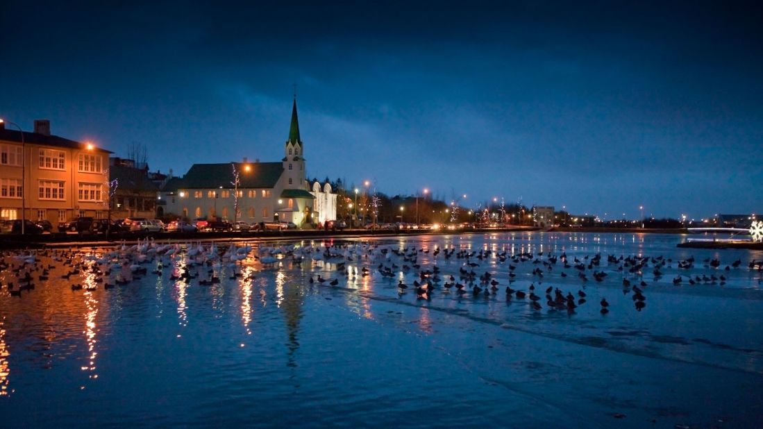 <strong>Tjörnin</strong> -- Tjörnin is a small lake rich with bird life, situated next to Reykjavík City Hall. It borders a scenic strip of Reykjavík, with colorful houses that beg to be photographed. 