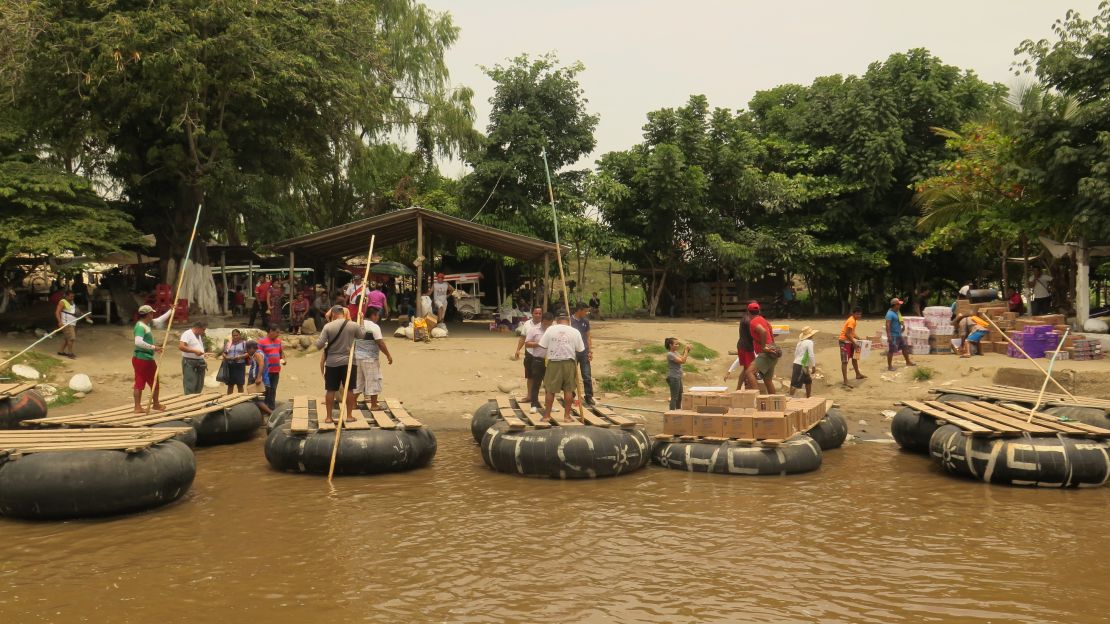 Goods are loaded onto rafts in Mexico and taken to Guatemala via the Suchiate River in May. 