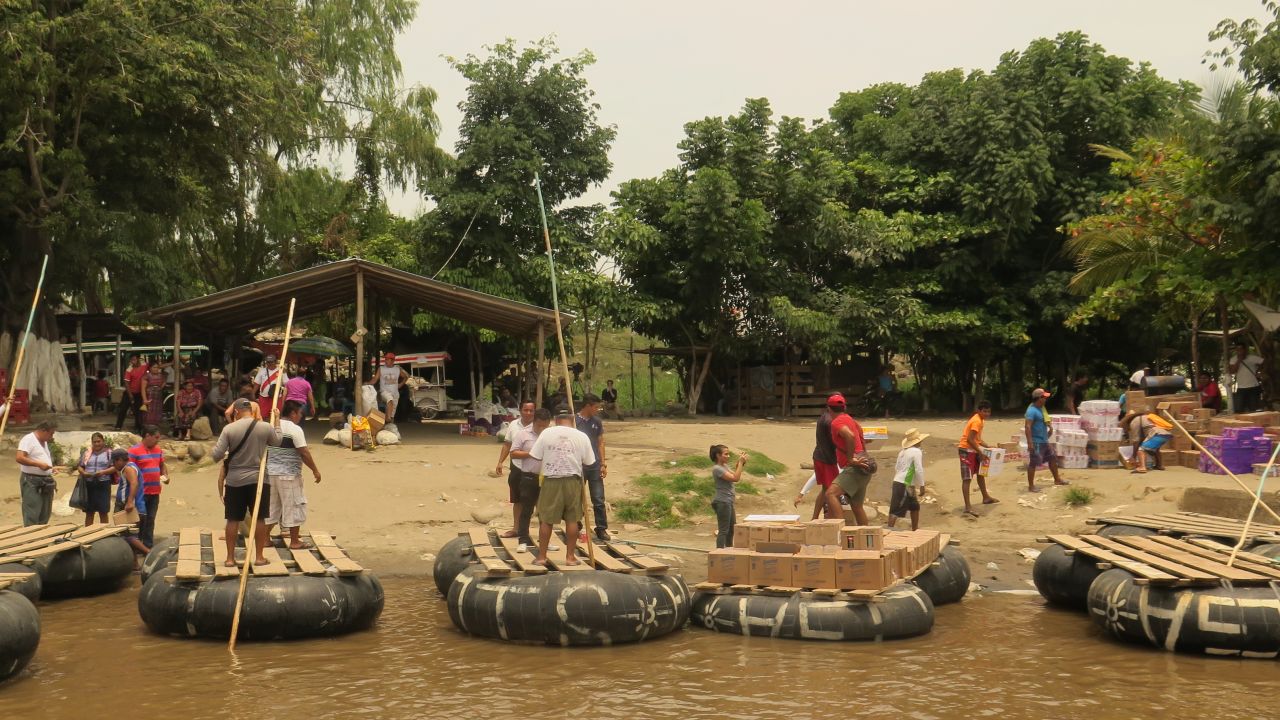 Goods are loaded onto rafts in Mexico and taken to Guatemala via the Suchiate River in May. 