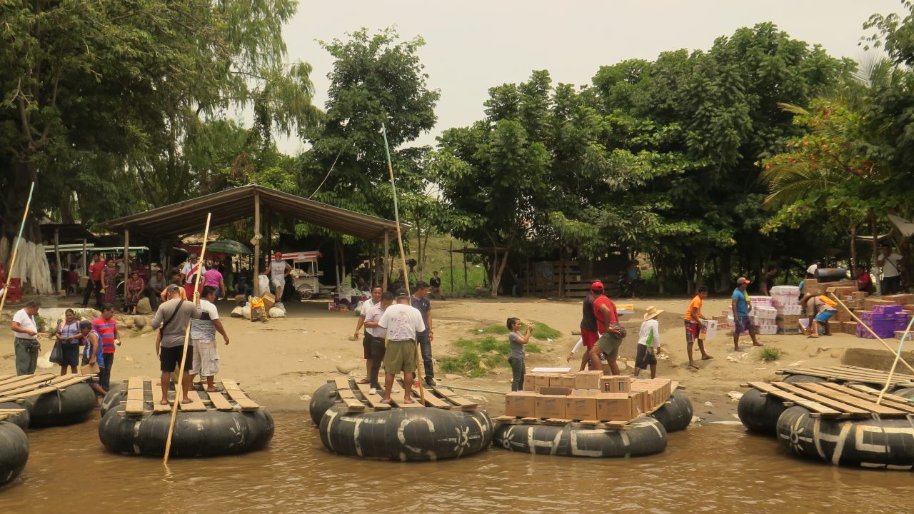 Goods are loaded onto rafts in Mexico and taken to Guatemala via the Suchiate River in May.