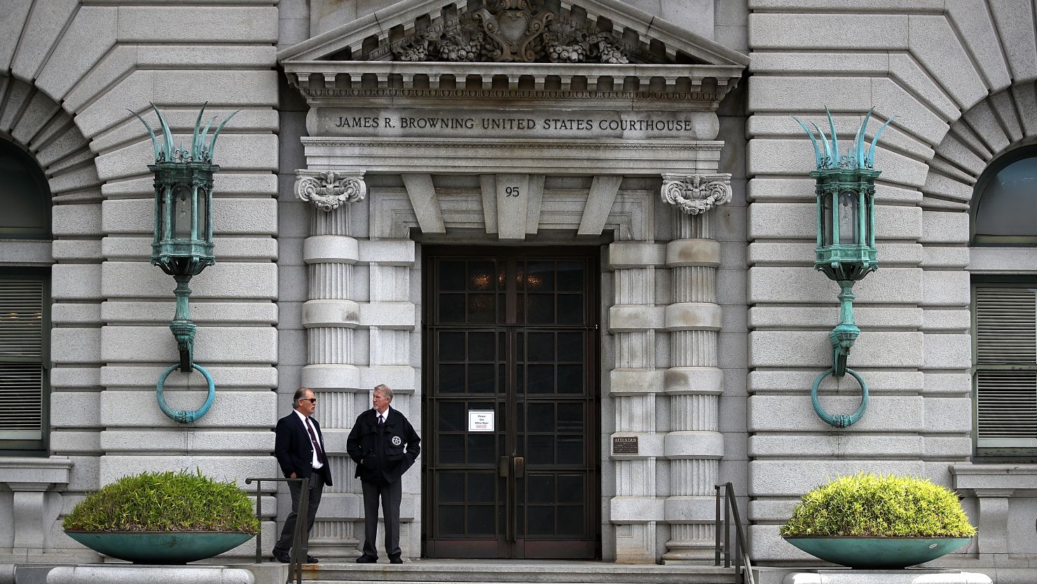 Security guards stand in front of the Ninth US Circuit Court of Appeals on June 12, 2017, in San Francisco, California.