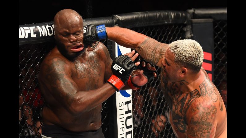 Mark Hunt punches Derrick Lewis during their UFC bout in Auckland, New Zealand, on Sunday, June 11. Hunt stopped Lewis in the fourth round.