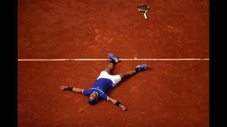 Rafael Nadal lies on the Roland Garros clay as he celebrates his victory in <a href="index.php?page=&url=http%3A%2F%2Fwww.cnn.com%2F2017%2F06%2F11%2Ftennis%2Ffrench-open-nadal-wawrinka-decima%2Findex.html" target="_blank">the French Open final</a> on Sunday, June 11. He defeated Stan Wawrinka 6-2, 6-3, 6-1 for his 10th French Open title. It's his 15th Grand Slam in all.