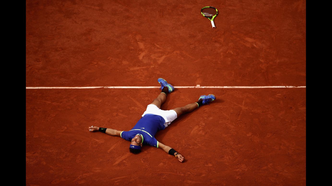 Rafael Nadal lies on the Roland Garros clay as he celebrates his victory in <a href="http://www.cnn.com/2017/06/11/tennis/french-open-nadal-wawrinka-decima/index.html" target="_blank">the French Open final</a> on Sunday, June 11. He defeated Stan Wawrinka 6-2, 6-3, 6-1 for his 10th French Open title. It's his 15th Grand Slam in all.