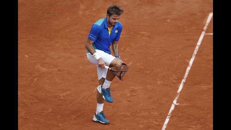 Stan Wawrinka breaks his racket over his knee during <a href="index.php?page=&url=http%3A%2F%2Fwww.cnn.com%2F2017%2F06%2F11%2Ftennis%2Ffrench-open-nadal-wawrinka-decima%2Findex.html" target="_blank">the French Open final,</a> which he lost in straight sets to Rafael Nadal on Sunday, June 11.