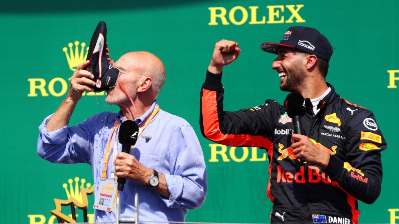 Actor Patrick Stewart drinks from Daniel Ricciardo's shoe after the Formula One driver, right, finished third in <a href="index.php?page=&url=http%3A%2F%2Fwww.cnn.com%2F2017%2F06%2F11%2Fmotorsport%2Ff1-canada-hamilton-vettel%2Findex.html" target="_blank">the Canadian Grand Prix</a> on Sunday, June 11. The "shoey" is Ricciardo's signature celebration.