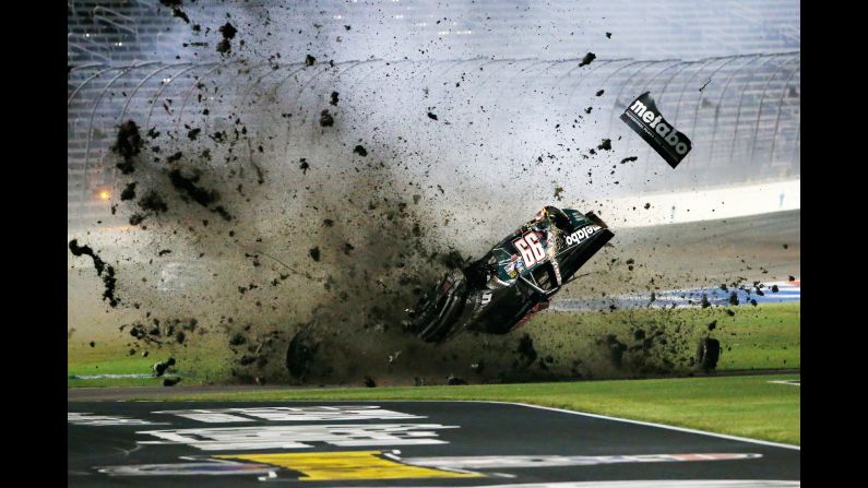 Timothy Peters flips over in the infield grass during the NASCAR Truck Series race in Fort Worth, Texas, on Friday, June 9. Peters walked away from the wreck and was fine, he said.